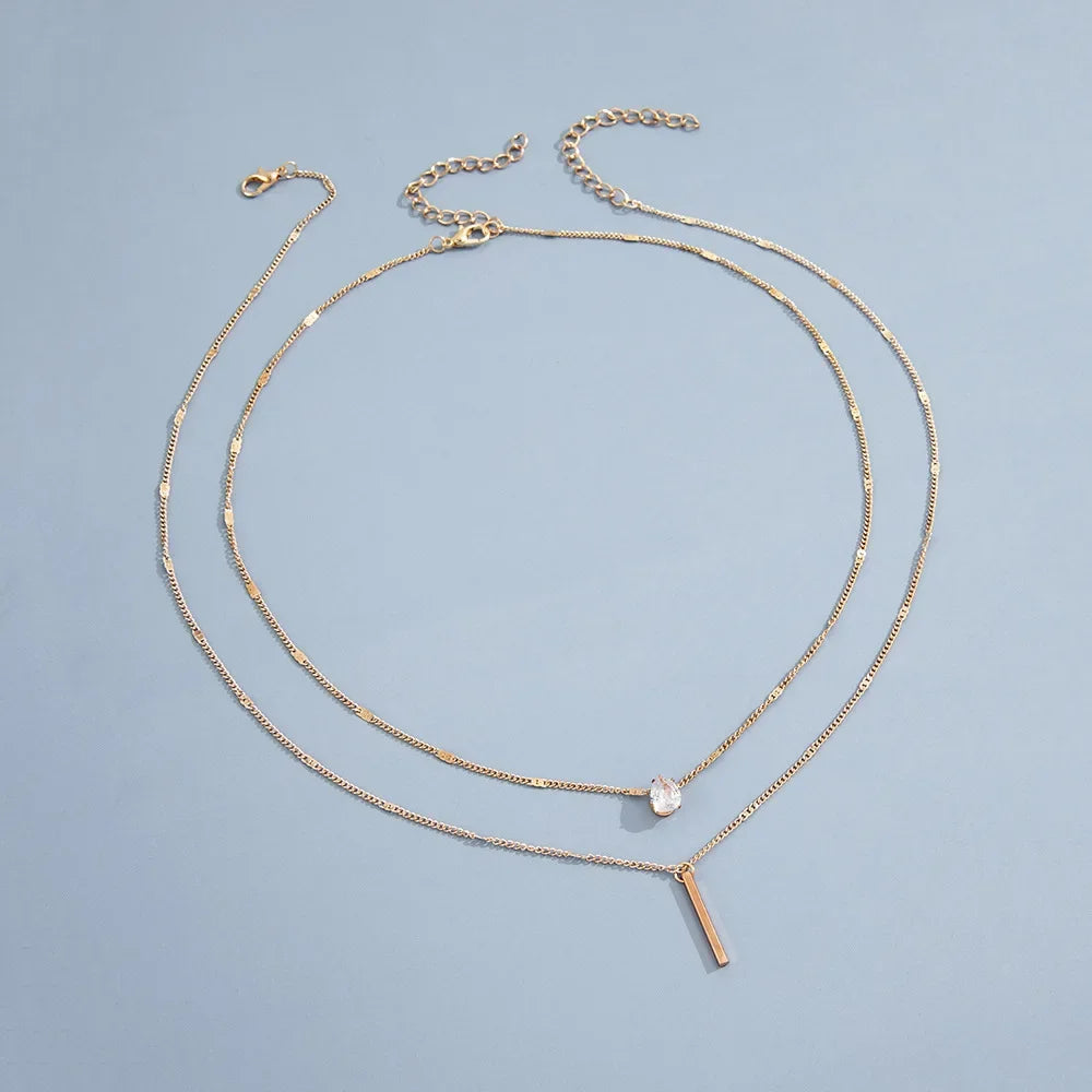 An eye catching Multi-layer Necklace with a Simple Crystal Water Drop in Gold or Silver Color